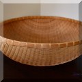 D54. Woven basket. 6”h x 17”w - $18 